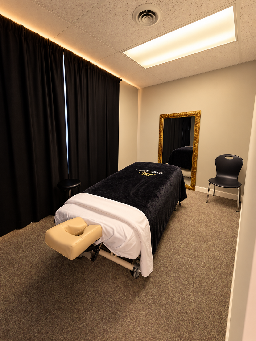 Polished massage treatment room inside Master’s Touch